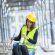 Kneeling female engineer on a construction site